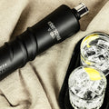 Roberto Cavalli Night Edition Total Black vodka bottle beside two drinks